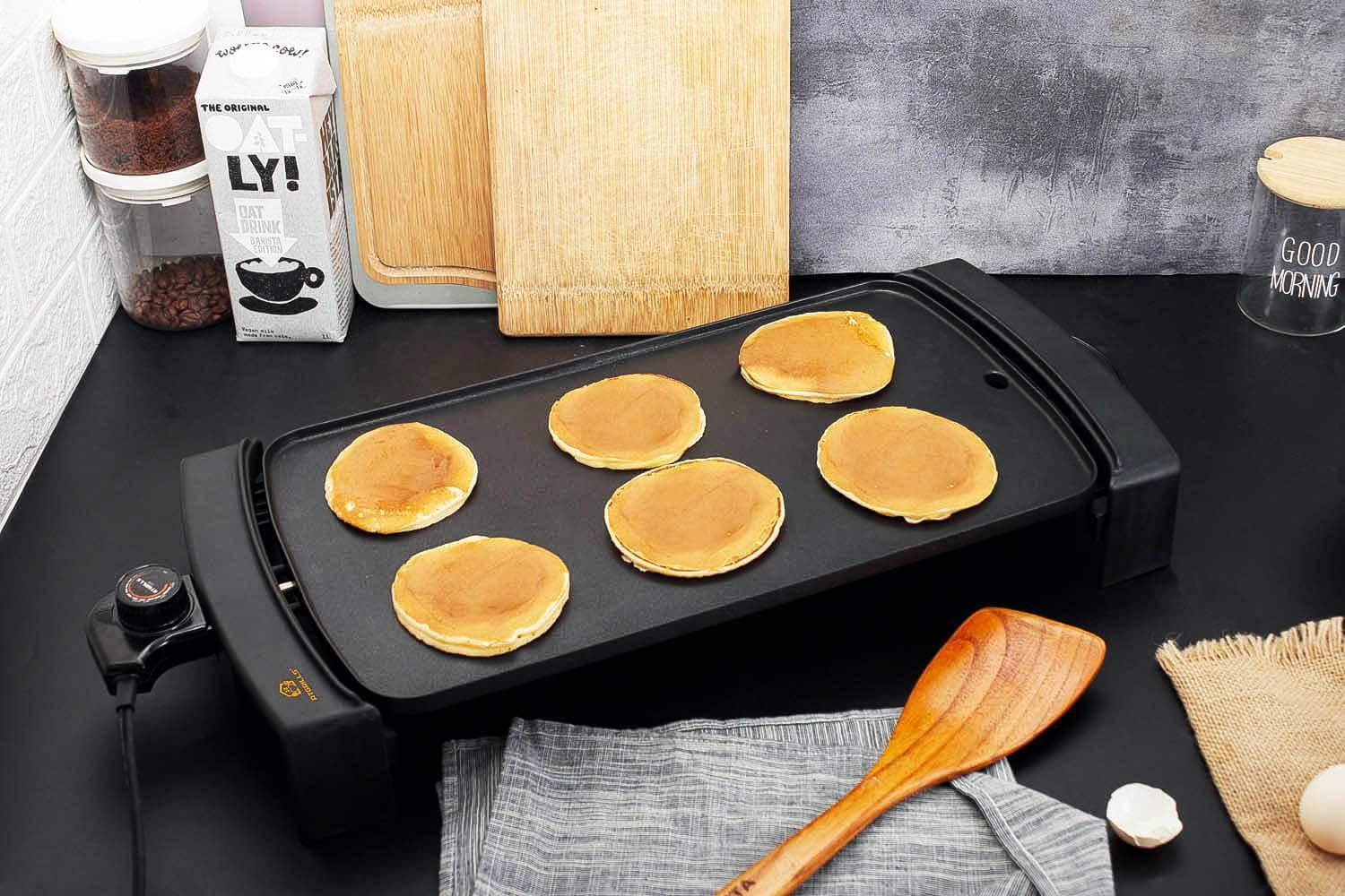 Pancakes on black indoor electric grill
