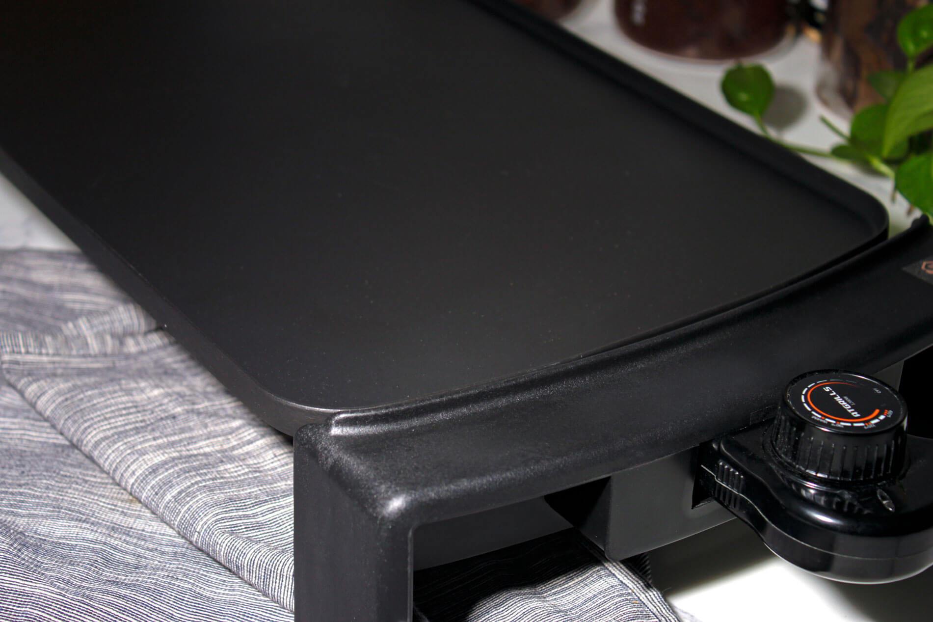 Black electric griddle with temperature controller