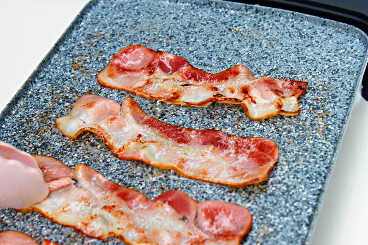 Cooking bacon on indoor electric smokeless griddle
