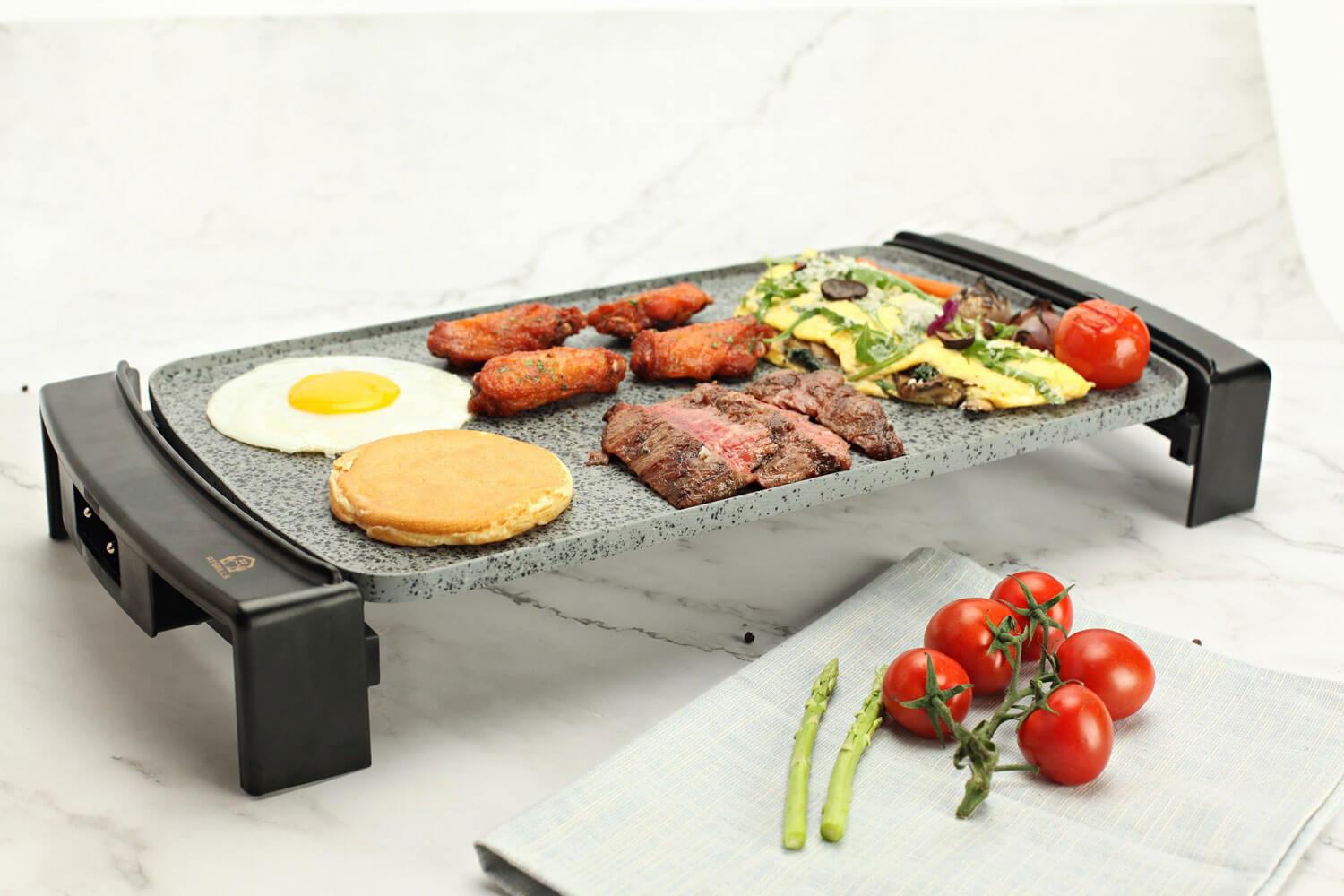 Food on electric indoor griddle with stone coating